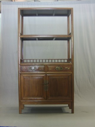 An Eastern elmwood cabinet, the back fitted 2 shelves above 2 drawers and a double cupboard 37"