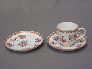 An 18th Century Oriental porcelain coffee can and saucer with armorial decoration together with 1 other saucer