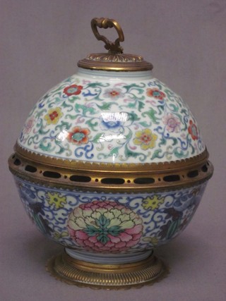 A globular shaped Continental porcelain jar and cover with pierced gilt metal mounts 6"