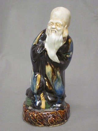 An Oriental porcelain figure of a standing sage 8" (cracked)