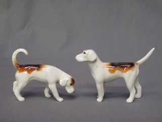 A pair of Beswick figures of fox hounds 3"