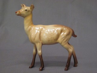 A Beswick figure of a standing fallow deer 6"