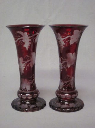 A handsome pair of Bohemian red etched glass vases of waisted form with vinery decoration, raised on cut bases 7" (1 with chips to rim)
