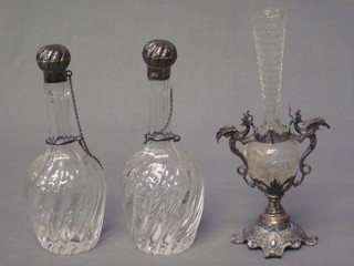 A pair of Continental club shaped glass scent bottles and stoppers with silver mounts 6" together with a glass vase contained in a silver mount 