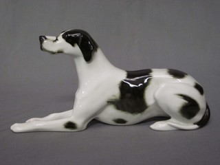 A Soviet Russian porcelain figure of a reclining dog 11"