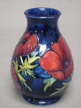 A modern Moorcroft blue ground vase decorated anemones, base impressed Moorcroft Made in England 5"