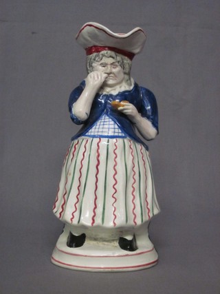 An 18th/19th Century Staffordshire jug in the form of Mrs Toby Philpot taking snuff 10" (handle f, spout f and r) 