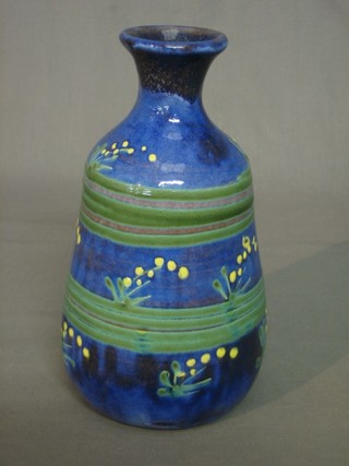 A Devon style blue glazed club shaped pottery vase 9"