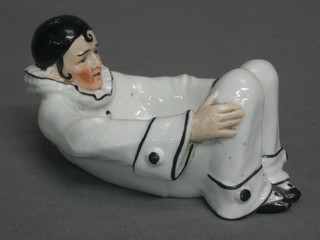 A 1920's Continental porcelain soap dish in the form of a reclining Pierrot, base marked 23159 5"