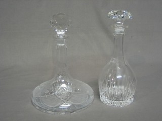 A cut glass ships decanter and a cut glass mallet shaped decanter and stopper