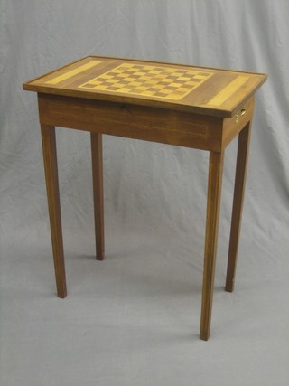 A Victorian rectangular mahogany games table with hinged lid, the lid inlaid a chess board and raised on square tapering supports 24"