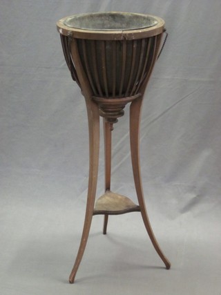 An Edwardian circular bleached mahogany jardiniere with metal bucket, raised on splayed supports 14" (requires some attention)   