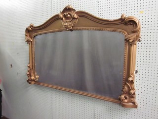 A 19th Century rectangular plate over mantel mirror contained in a decorative gilt frame 47"