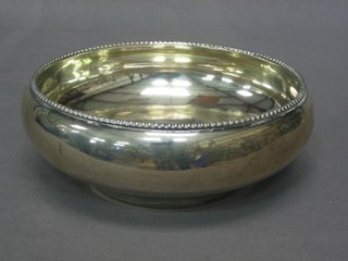 A circular Continental silver bowl with bead work border marked 800, 9 ozs