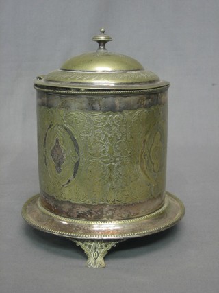 An engraved cylindrical silver plated biscuit barrel and cover, raised on 3 bracket feet
