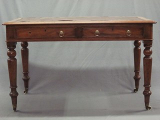 A Victorian rectangular mahogany library table with inset writing surface above 2 long drawers, raised on turned supports 47"