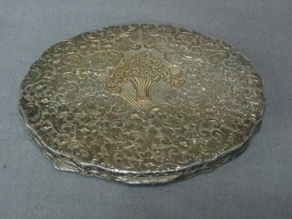 An oval engraved white metal powder compact