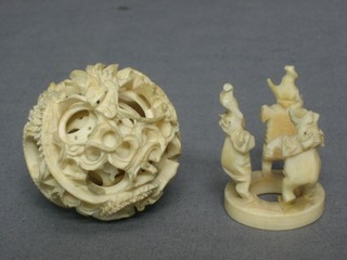A carved ivory puzzle ball 2"