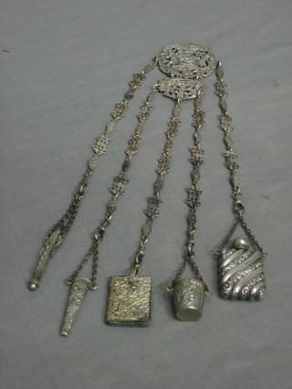 A 19th Century pierced Continental silver chatelaine hung needle case, scissor case (no scissors), pin cushion, thimble and scent bottle
