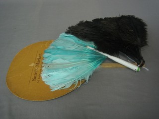 An ostrich feather fan and 2 others