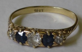 A lady's 18ct yellow gold dress ring set 3 diamonds and 2 sapphires