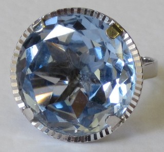 A white metal dress ring set a circular cut spinnell