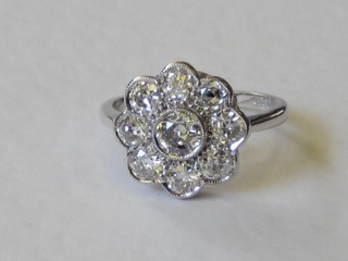 A lady's 18ct white gold cluster dress ring set 9 diamonds, approx 1.45ct