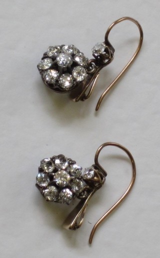 A pair of lady's diamond cluster drop earrings