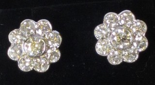 A pair of circular diamond ear studs set 9 diamonds, approx 2.60ct