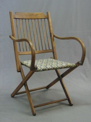 A beech framed stick and rail back folding campaign chair