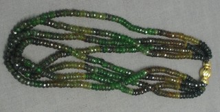 A 4 row multi coloured string of tourmaline beads with 14ct gold clasp