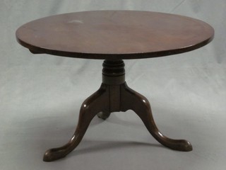 A circular mahogany tea table raised on a pillar and tripod base 31"