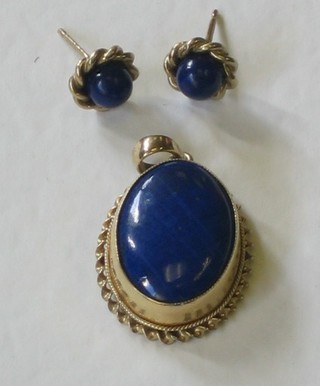 A Lapis Lazuli pendant and a matching pair of ear studs