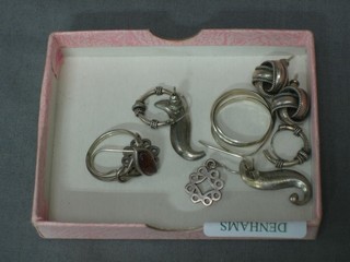 2 silver dress rings and 4 pairs of silver earrings