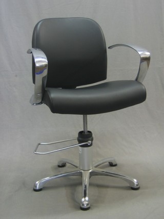 A "Designer" chrome revolving office chair