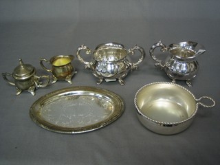 2 silver plated twin handled sugar bowls and cream jugs, a silver plated wine taster and an oval tray