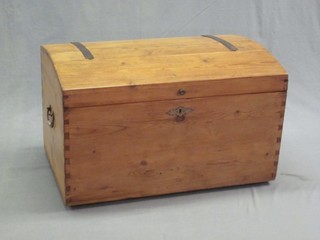 A Continental stripped and polished pine trunk with iron drop handles 32"