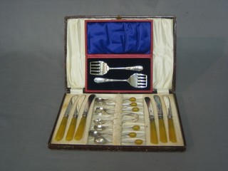 A pair of silver plated sardine servers and a set of 6 silver plated coffee spoons and 6 silver plated tea knives