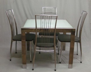 A "Designer" dining suite comprising extending chromium framed and glass extending dining table together with a set of 4 chrome stick back dining chairs