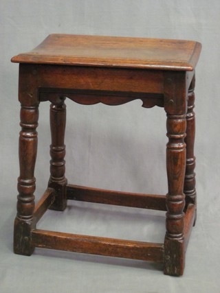 A 19th Century rectangular oak joyned stool, raised on turned and block supports 18"