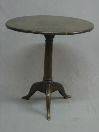 An 18th/19th Century circular oak and elm tea table, raised on pillar and tripod supports 36"