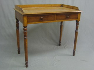A 19th Century mahogany wash stand with three-quarter gallery, fitted 2 drawers and raised on turned supports 36"