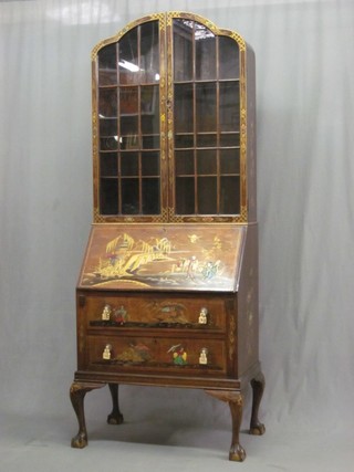 A 1930's chinoiserie style lacquered bureau bookcase, the upper section with adjustable shelves enclosed by astragal glazed panelled doors, the base fitted a fall front revealing a well fitted interior above 2 short drawers, raised on cabriole supports 29"