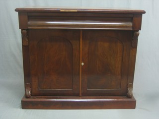 A Victorian mahogany chiffonier fitted 1 long drawer above a double cupboard enclosed by arched panelled doors, raised on a platform base 42"