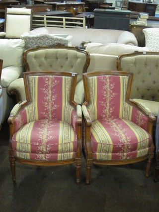 A pair of mahogany framed show frame tub back chairs upholstered in pink striped material