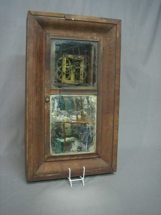 An American 19th Century 30 hour striking wall clock contained in a walnut case (requires attention)