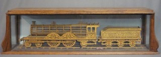 A 20th Century fret work model locomotive and  tender 49" together with a bronze medal dated 1911