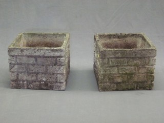 A pair of well weathered square concrete garden planters 13"