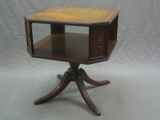 A Georgian style lozenge shaped occasional table with inset leather surface, the base fitted a recess, raised on pillar and tripod supports 25"