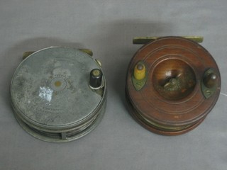 The Perfect centre pin fly reel by Hardy Bros. 4" and a wooden star back reel 3 1/2"